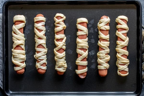 Mummy Hot Dogs with Golden Crescent Roll Bandages